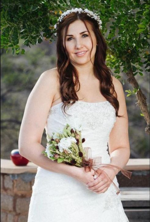 Bride with a flower crown holding a bouquet