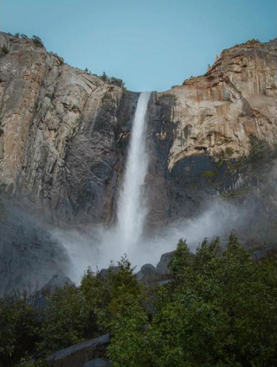 Bridalveil Fall pouring down granite cliffs in Yosemite